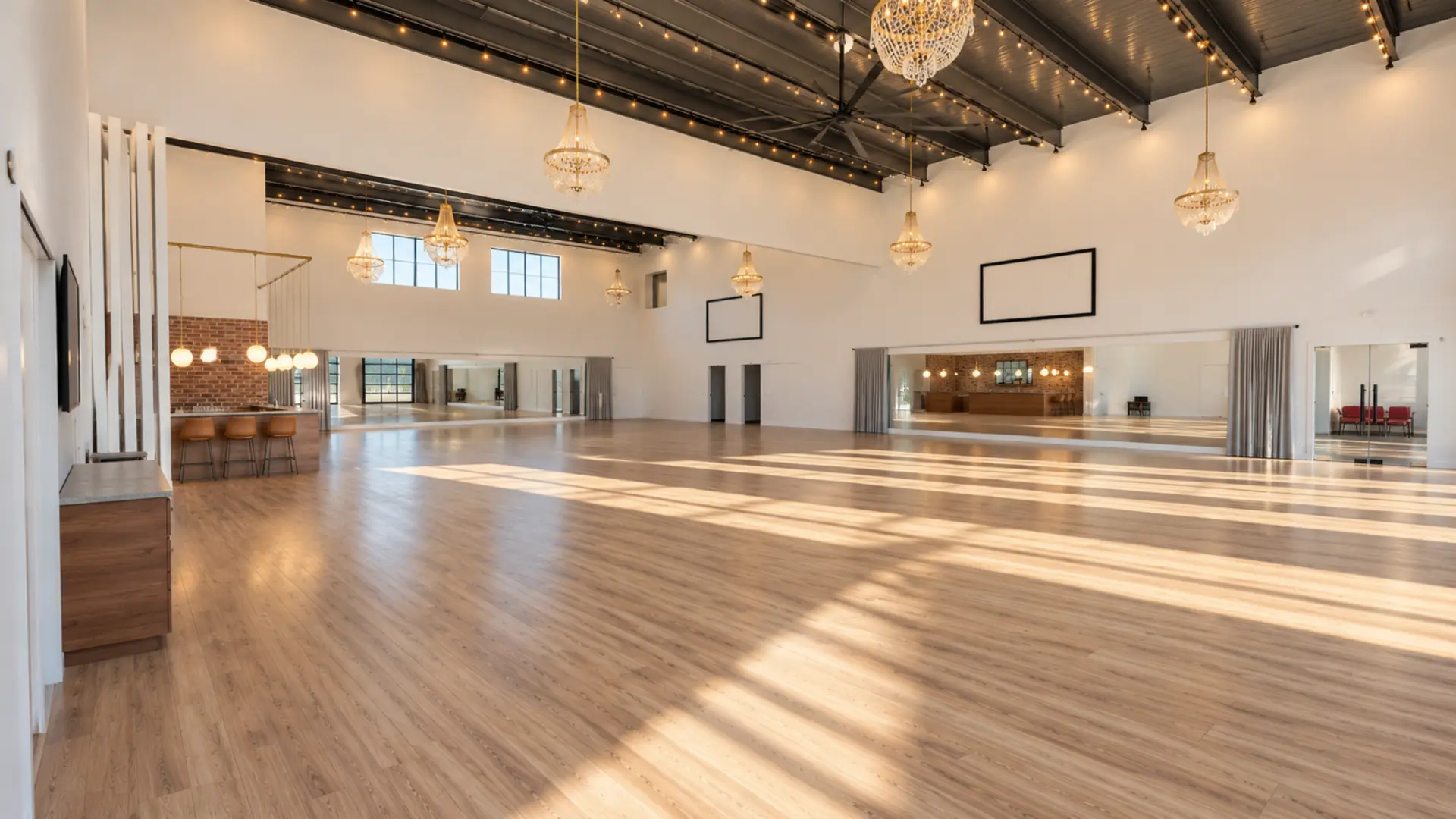 Artist rendering of the Gilded Room with crystal chandeliers, expansive wall mirrors, sunlit hardwood floors and a built-in bar